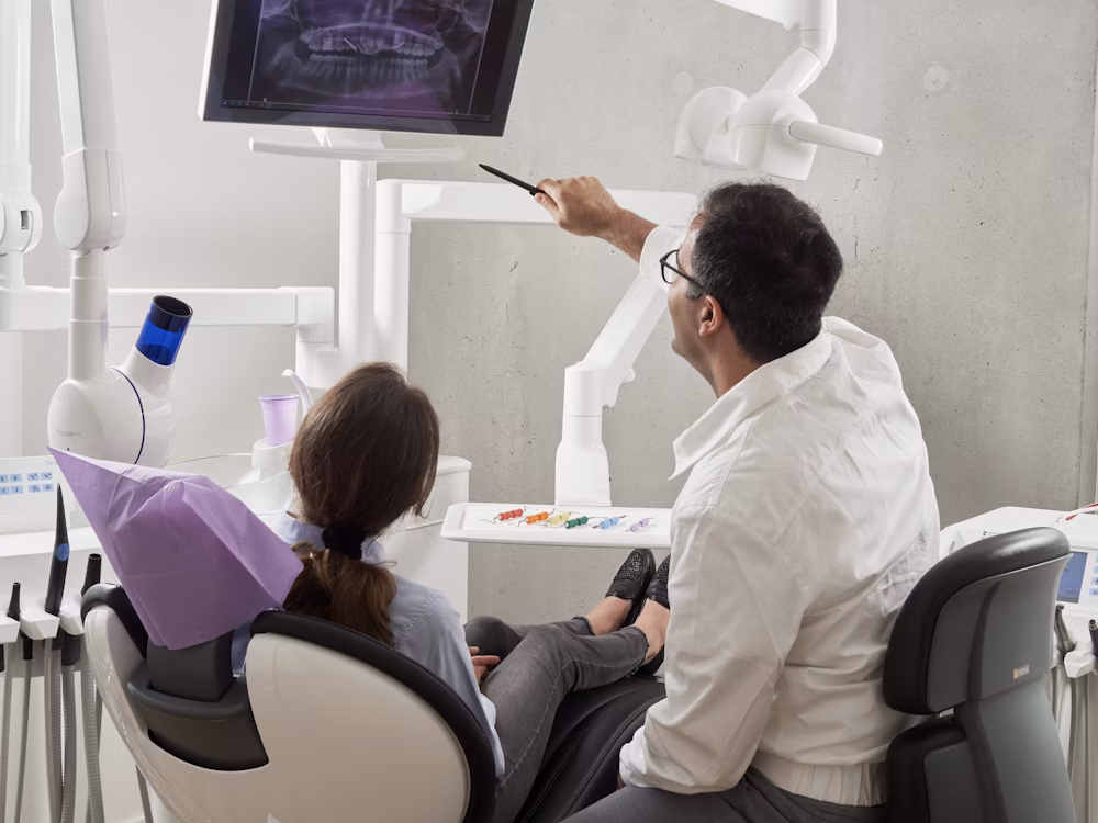 Dentist running a check up